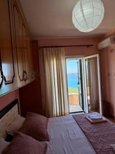 a bedroom with two beds with a view of the ocean at Levi's Villa Radhima in Vlorë