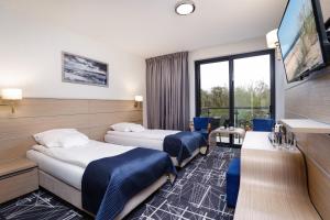 Postel nebo postele na pokoji v ubytování Hotel Faleza - z widokiem na morze + 37 fotografií