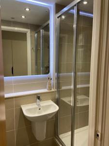 a bathroom with a sink and a shower at The Depot in Bath in Bath
