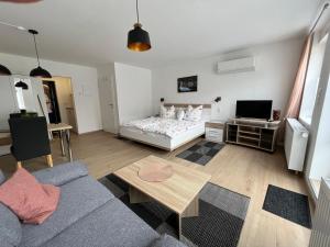 Postel nebo postele na pokoji v ubytování Ferienwohnungen und Appartements - Haus Budinger