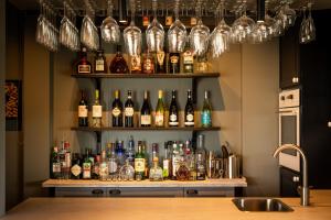 a bar with a lot of bottles of alcohol at Hestheimar in Hella