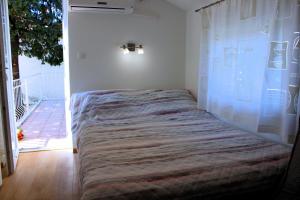 Posteľ alebo postele v izbe v ubytovaní Apartment Studio Olga