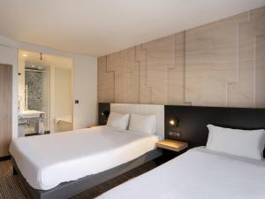 Postel nebo postele na pokoji v ubytování B&B HOTEL Lorient Ploemeur