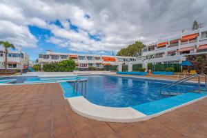 a swimming pool in front of a building at Costa del Silencio Tenerife Sur in Arona