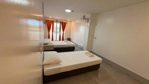 Postel nebo postele na pokoji v ubytování MAMORI HOTEL