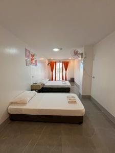 Postel nebo postele na pokoji v ubytování MAMORI HOTEL