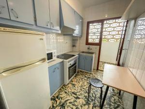 Kuchyň nebo kuchyňský kout v ubytování Apartamentos Gandia-Daimuz 3000