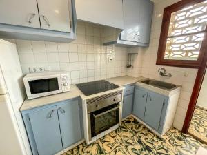 Kuchyň nebo kuchyňský kout v ubytování Apartamentos Gandia-Daimuz 3000