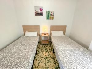 Postel nebo postele na pokoji v ubytování Apartamentos Gandia-Daimuz 3000