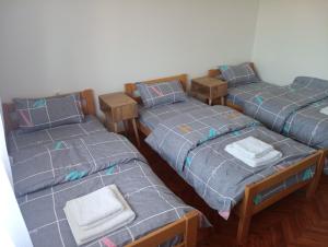 Rúm í herbergi á Apartman Aleksić Kuršumlija