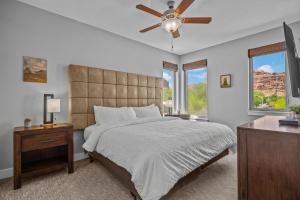 a bedroom with a bed and a ceiling fan at Entrada at Moab 420 and 424 in Moab +63 photos