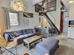 a living room with a couch and a table at Appartement Val-d'Isère, 4 pièces, 6 personnes - FR-1-411-682 in Val-d'Isère