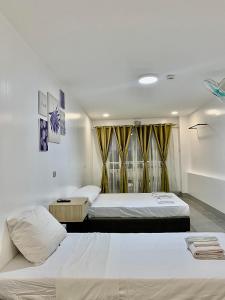 Postel nebo postele na pokoji v ubytování MAMORI HOTEL