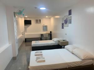 Postel nebo postele na pokoji v ubytování MAMORI HOTEL