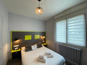 Letto o letti in una camera di Hôtel du Musée