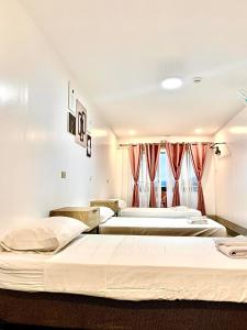 Postel nebo postele na pokoji v ubytování MAMORI HOTEL