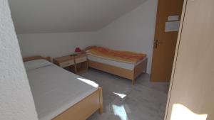 Postel nebo postele na pokoji v ubytování Apartman Tea