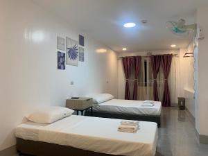 Postel nebo postele na pokoji v ubytování MAMORI HOTEL