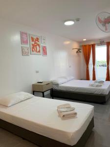Postel nebo postele na pokoji v ubytování MAMORI HOTEL