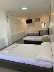 Postel nebo postele na pokoji v ubytování MAMORI HOTEL