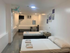 Postel nebo postele na pokoji v ubytování MAMORI HOTEL