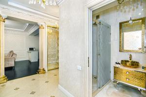 a bathroom with a sink and a mirror at Park Azure Deluxe Apartment By Baku Housing in Baku