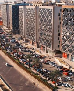 an aerial view of a parking lot in front of a building at The Panoramic View - Luxury Apartments in Cairo in Cairo