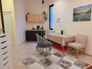 a kitchen with a table and chairs in a room at Royal Ruse Centre in Ruse
