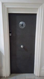 a black door with a sign on it at Green Lodge-Room-04 in Liverpool