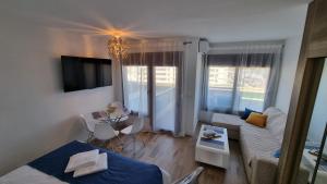 a small living room with a couch and a table at Blue Aloha Sea View in Benalmádena