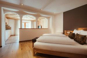 Postel nebo postele na pokoji v ubytování Refugium LaFlu Apartments