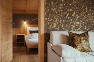 Postel nebo postele na pokoji v ubytování Refugium LaFlu Apartments