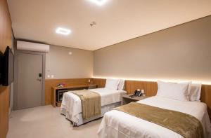 Amazon Aeroporto Hotel客房内的一张或多张床位