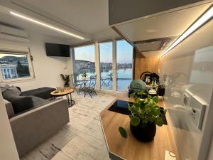 a living room with a couch and a table at Utopia View in Mytilene