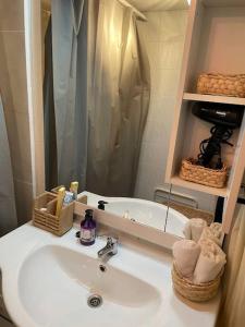 a bathroom sink with a mirror and a tub at Apartment with garden in Krems an der Donau