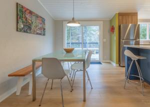 a kitchen and dining room with a table and chairs at Douglas Woods Retreat - Modern Cottage - Newly Remodeled! Walking distance to downtown Douglas! in Douglas