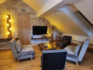 TV a/nebo společenská místnost v ubytování Krásný apartmán Refrino
