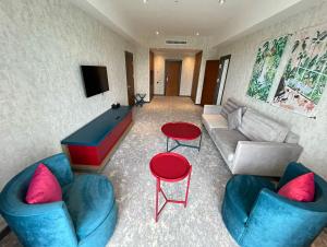 a living room with couches and a pool table at Arena Grand Hotel in Quba +43 photos