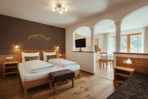 Postel nebo postele na pokoji v ubytování Refugium LaFlu Apartments