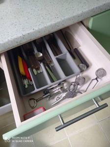 a drawer filled with lots of kitchen utensils at Lillijas iela 5 can stay Free parking Park in Rīga