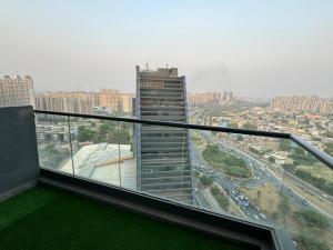 a view of a tall building from a balcony at Luxury stay by GT Studio in Ghaziabad
