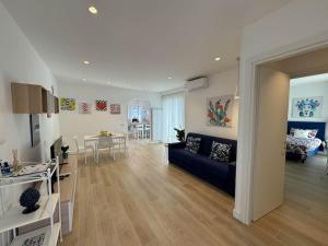 a living room with a blue couch in a room at Donna Antonietta in Sant'Agnello