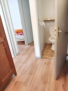 an open door to a bathroom with a toilet at Chalet de 3 chambres avec jardin amenage a Beaufort a 8 km des pistes in Beaufort