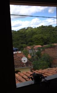 a view from a window of a roof at MangaMel Hostel in Lençóis