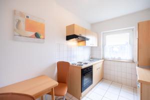 Kuchyň nebo kuchyňský kout v ubytování acora Bremen Garden Living the City