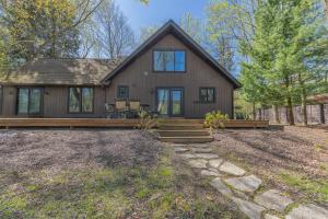 a home with a large house with a porch at Belacasa - Hot tub and within walking distance to Douglas Beach! in Douglas