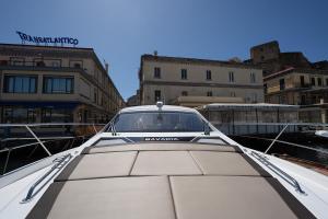 a white car parked on the back of a boat at GreRos Yacht by ClaPa H.&G Group in Naples