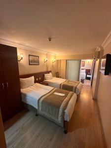 Postel nebo postele na pokoji v ubytování Hotel Akyildiz