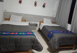 Letto o letti in una camera di HOSTAL La RASA