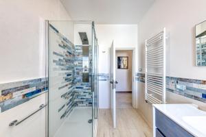a bathroom with a glass shower and a sink at Casa Vacanze Irene in Gagliano del Capo +23 photos